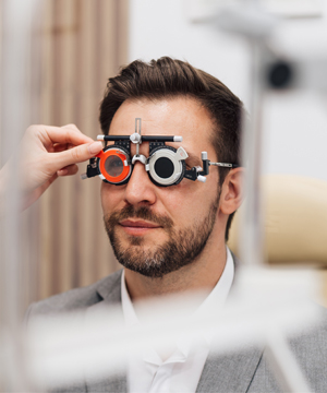 Woman undergoing a comprehensive eye health exam in Bard Optical Pekin